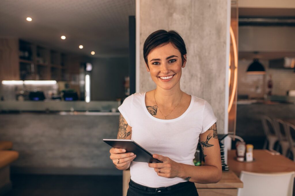 waitress in a restaurant with a big smile